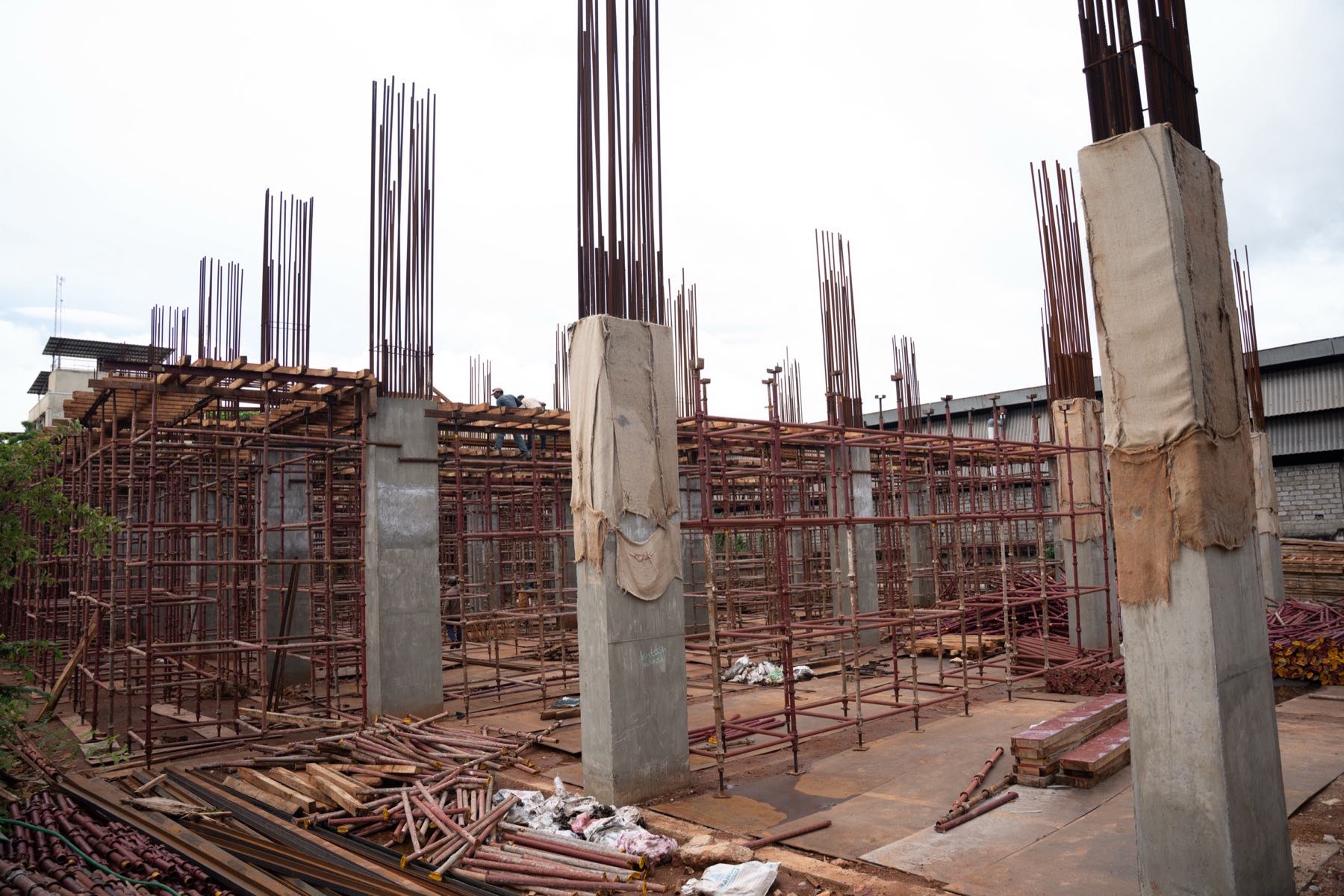 Vertical reinforcement and column forms on an upper slab
