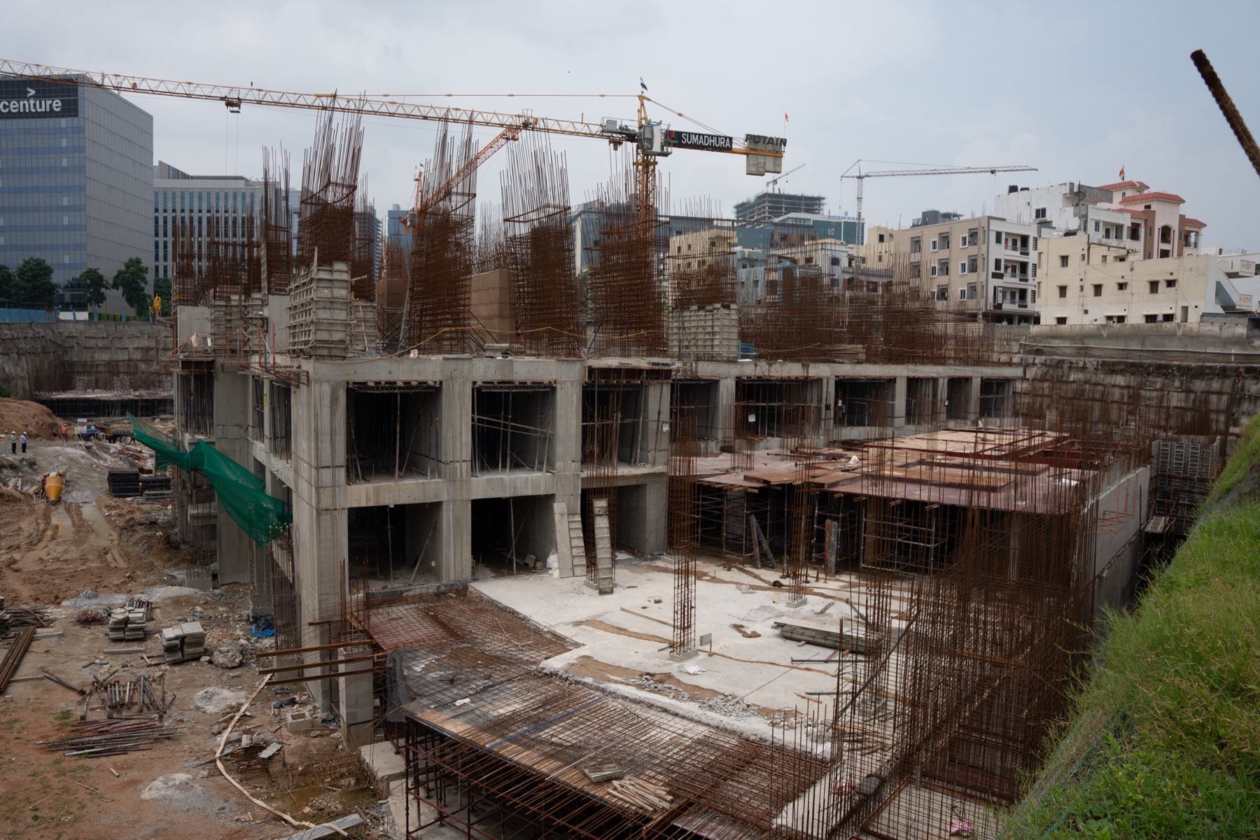 An elevated view of reinforcement and formwork across a live site