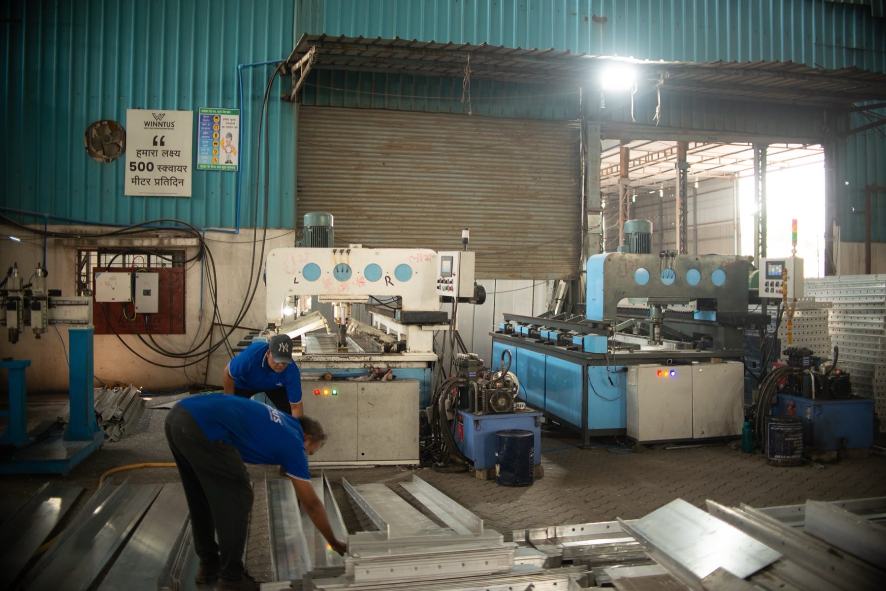 Machinery and stacked panels on the fabrication shop floor