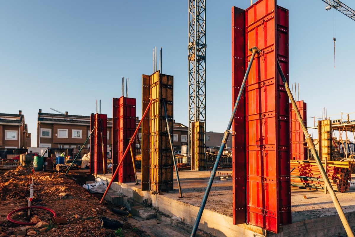 Aluminium formwork panels stacked on a construction site