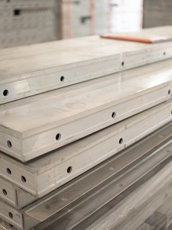 Built-up aluminium wall panels stacked in the storage hall
