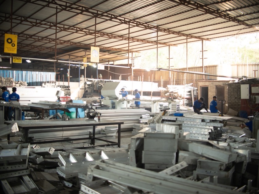 The fabrication floor with machinists at their benches